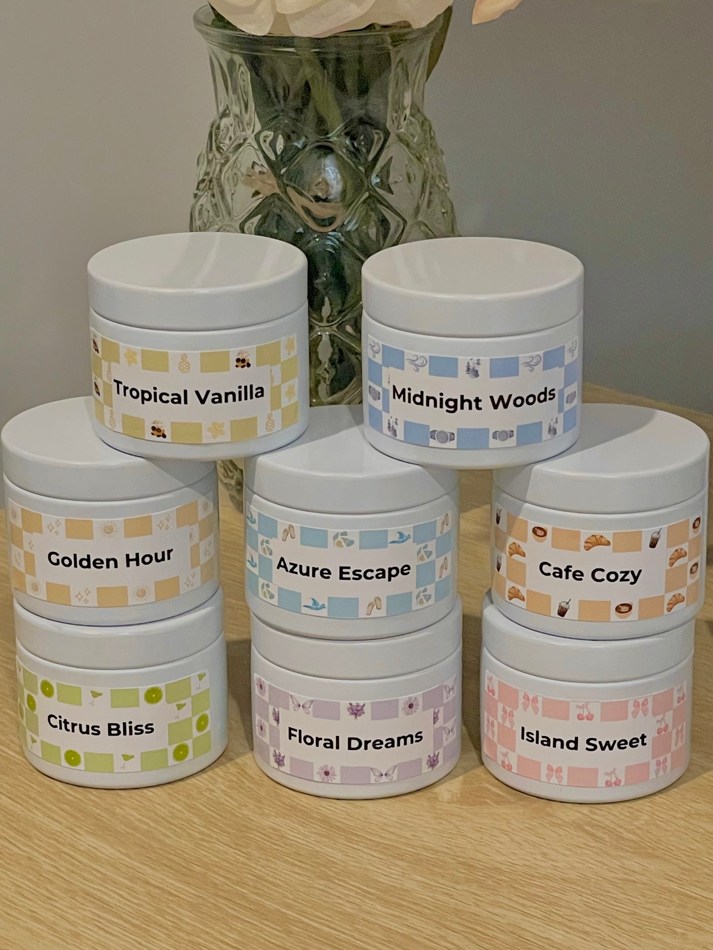 Set of small containers with labels on a wooden surface