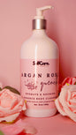 Body cleanser bottle with pump on a pink background with flowers