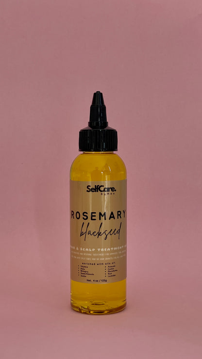 A bottle of SelfCare by Mee Rosemary Blackseed Scalp Treatment with a black dropper cap, filled with yellow oil, set against a solid dusty pink background.
